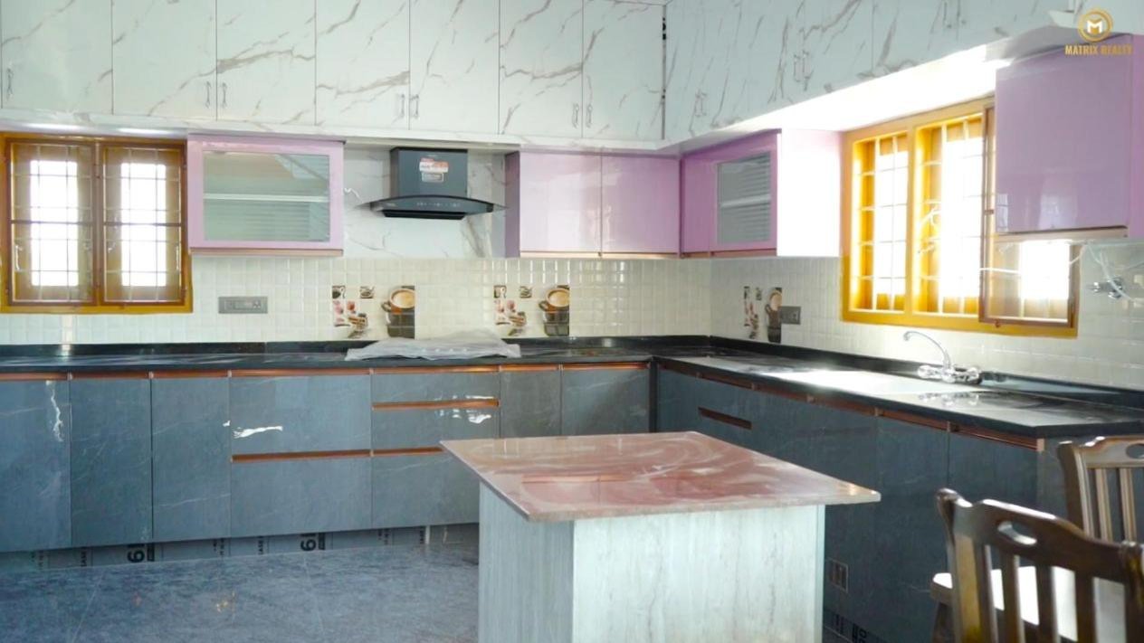 Modular kitchen with island counter in a Matrix Realty home